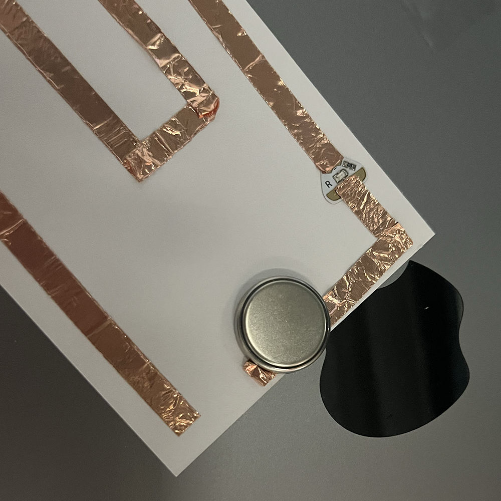 Making test of low voltage electricity through complex pathway using copper tap.